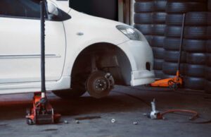 The white color Car for repair in shed without wheel in Phoenix & Las Vegas